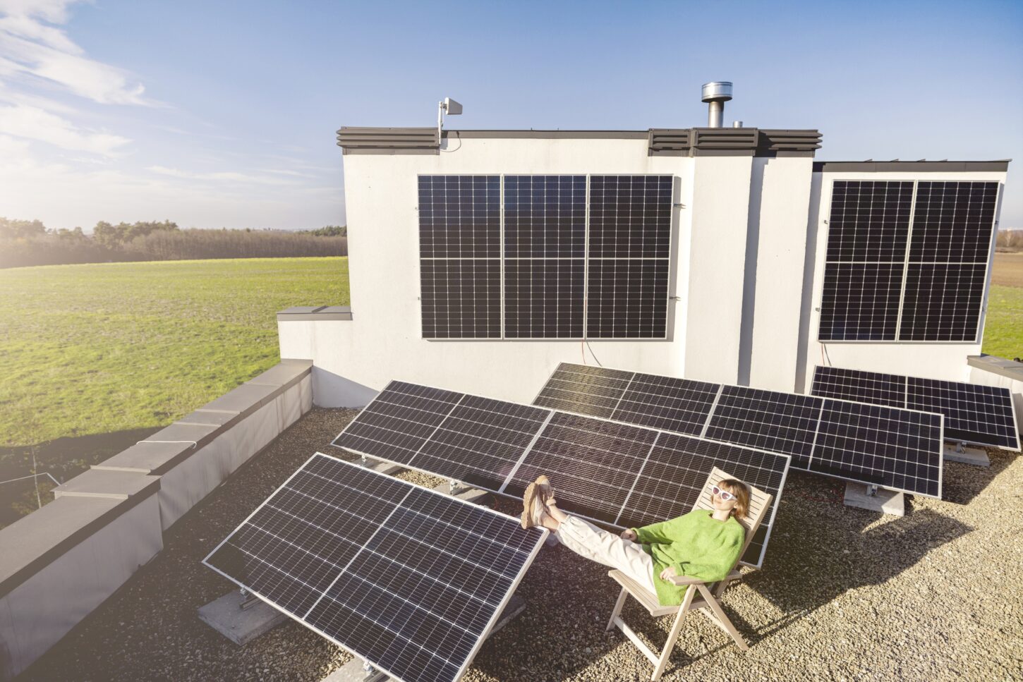 woman-on-rooftop-of-her-house-with-a-solar-station
