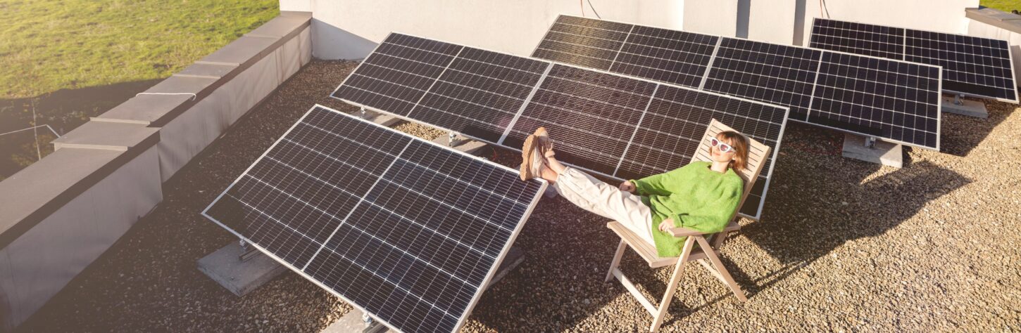 woman-on-rooftop-of-her-house-with-a-solar-station-2